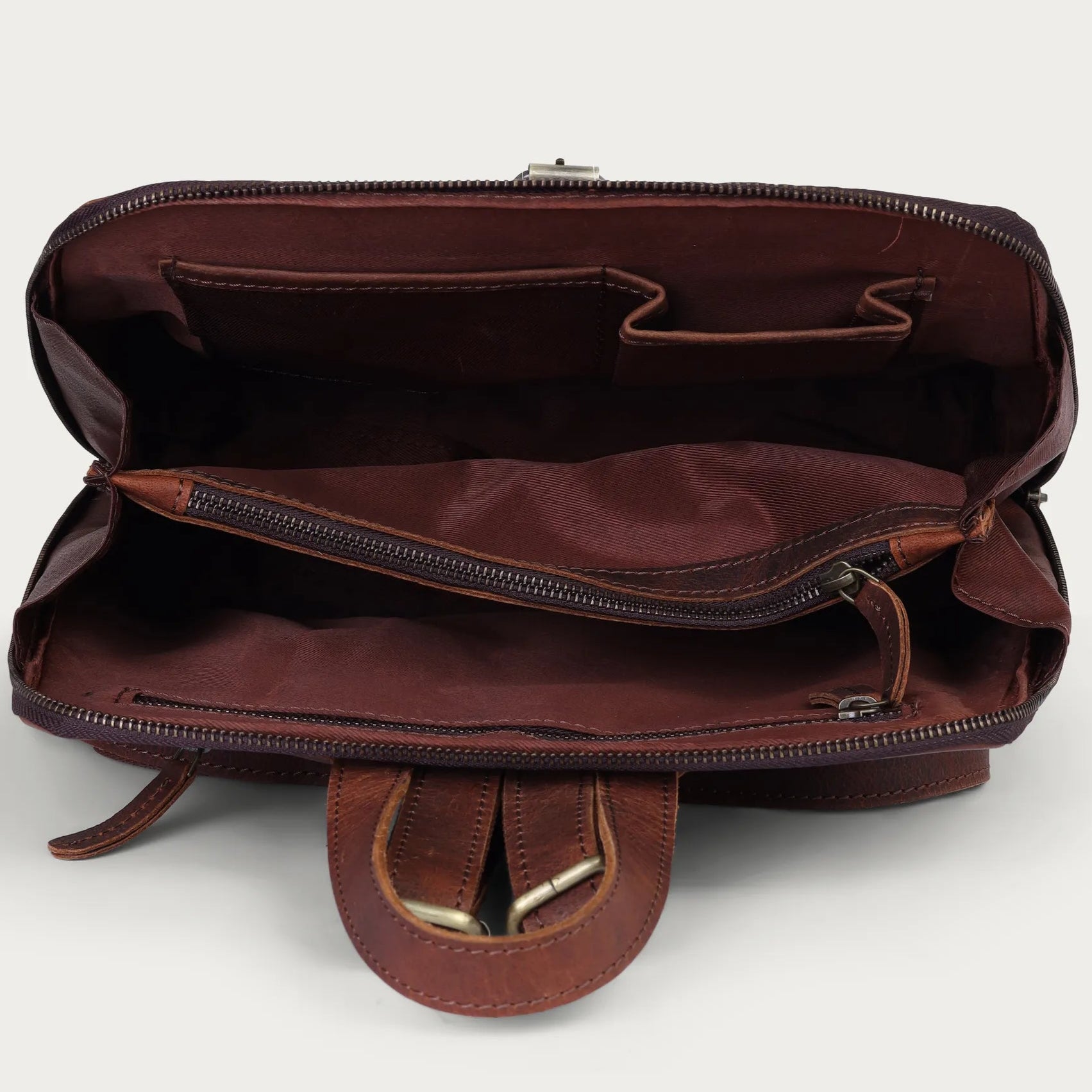 Brown leather bag with open front pocket on a white background