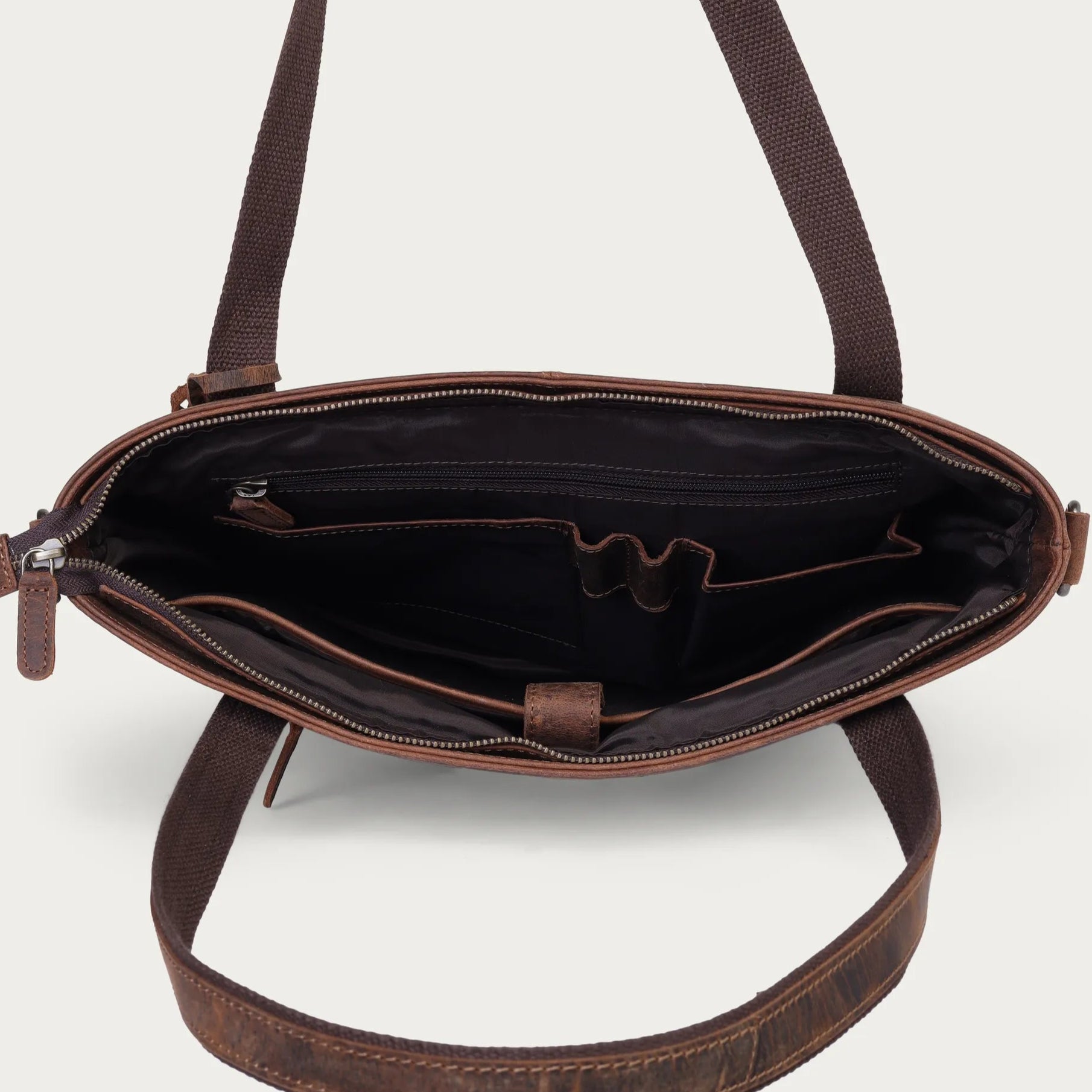 Brown leather crossbody bag on a white background