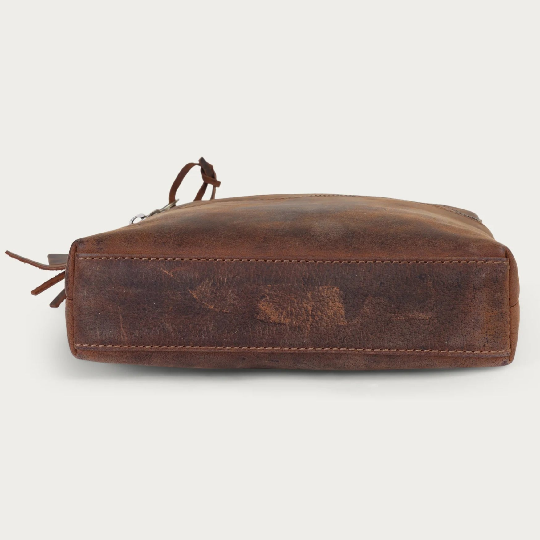 Brown leather pouch on a white background