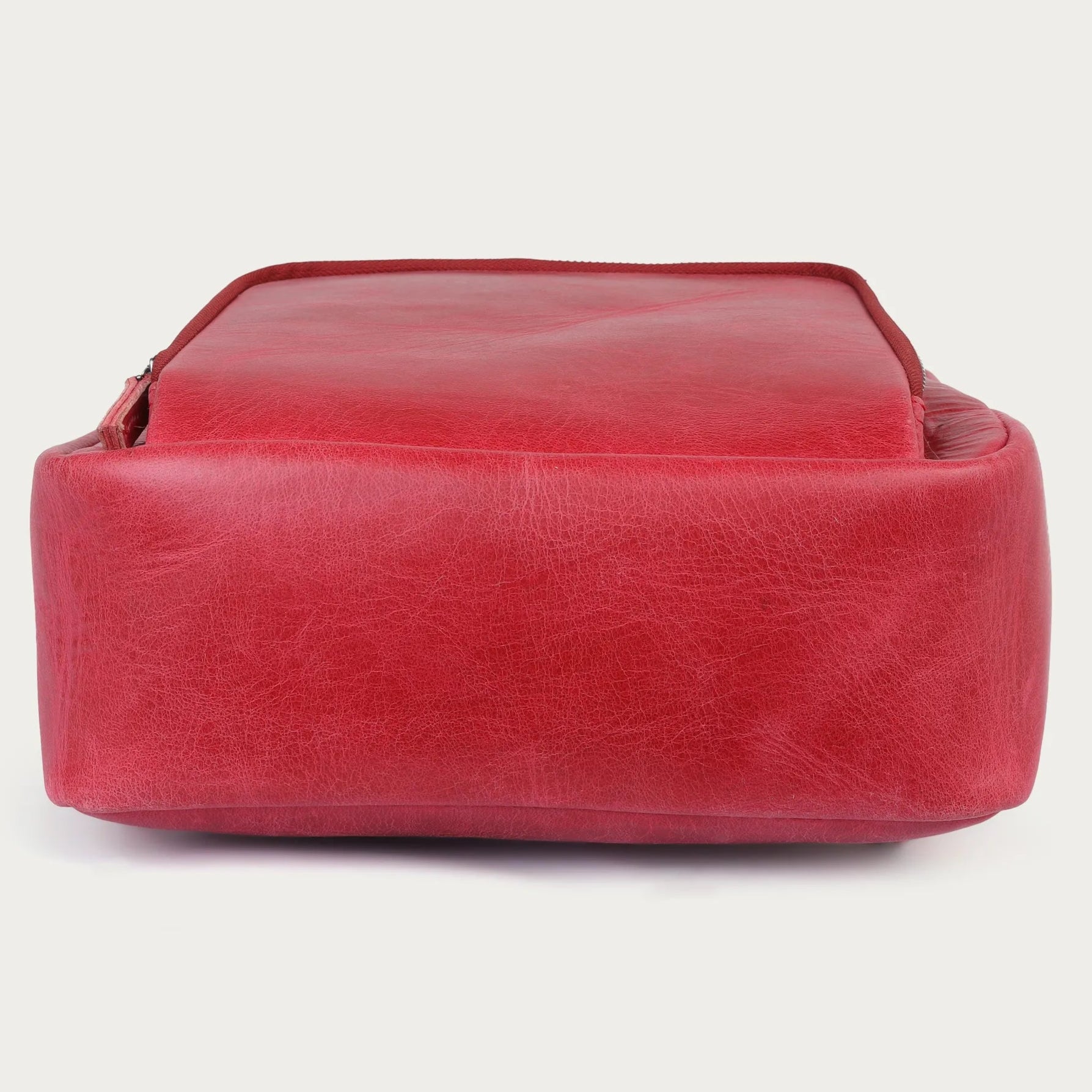 Red leather bag on a white background