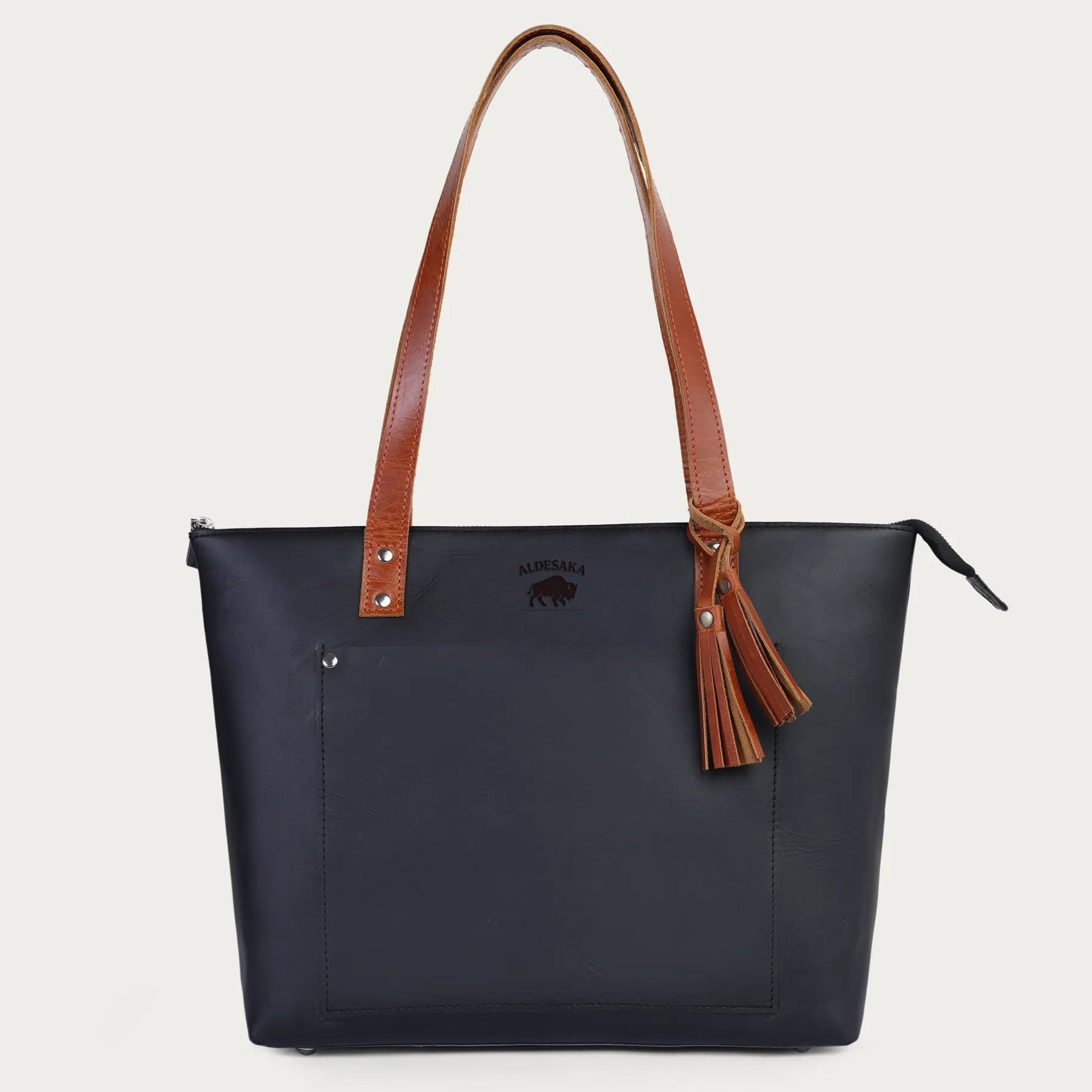 Black leather tote bag with tan handles – front view

