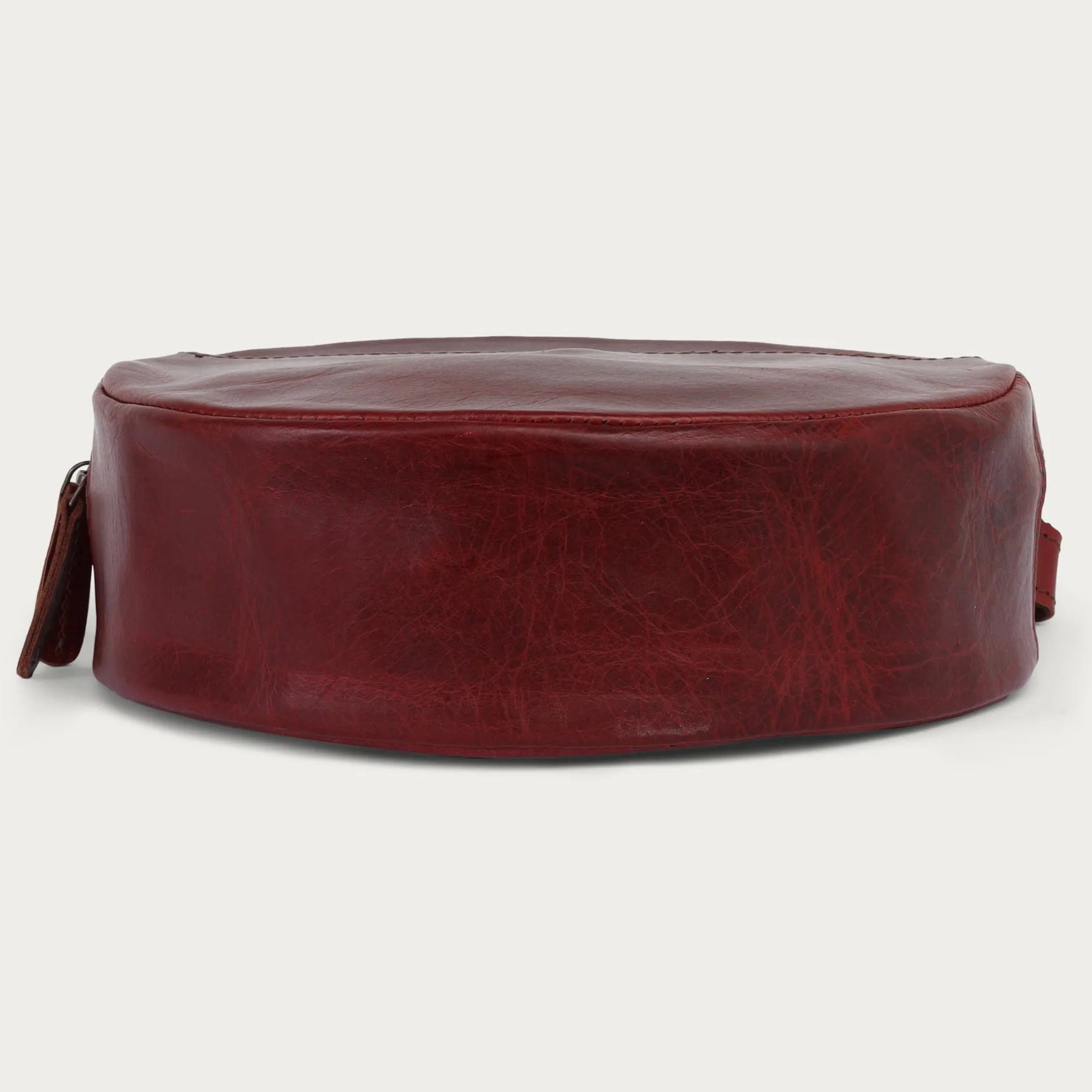 wine leather bag on a light gray background